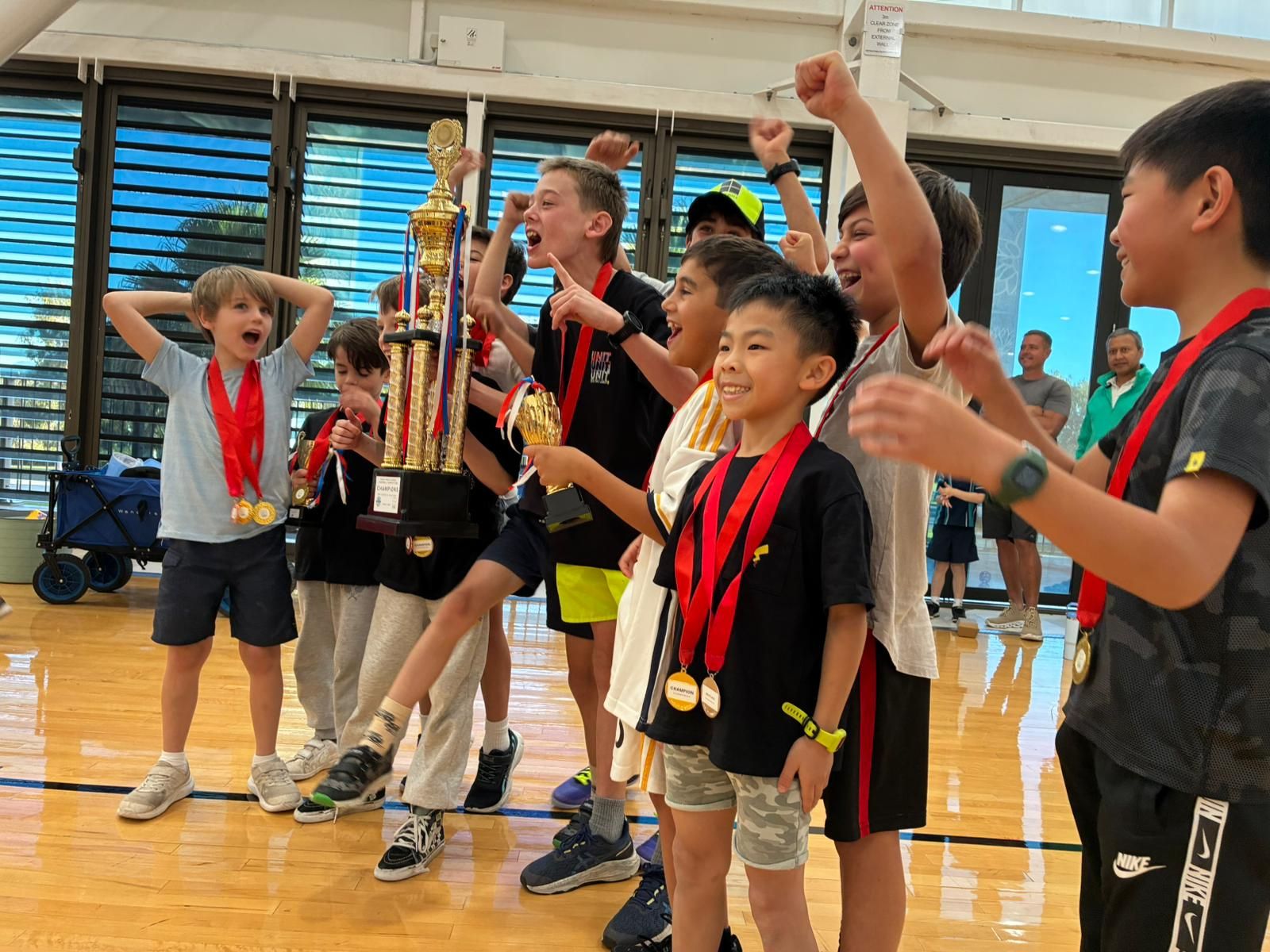 Kids having fun playing handball at a holiday camp program