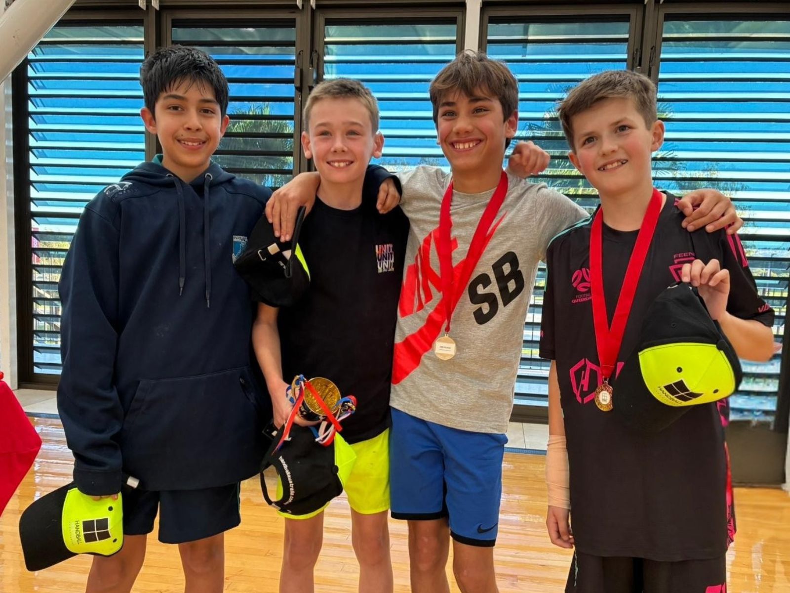 Kids having fun playing handball at a holiday camp program