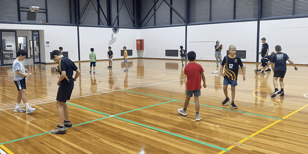 Kids having fun playing handball at a holiday school program