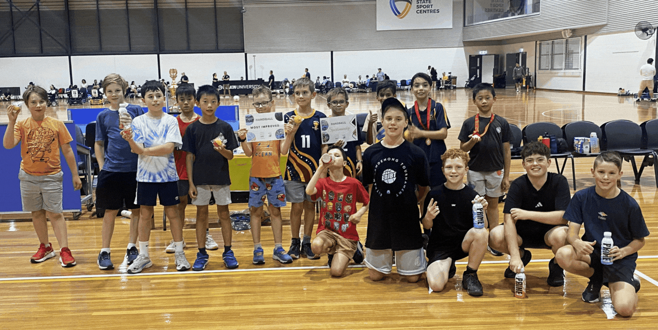 Kids having fun playing handball at a holiday school program