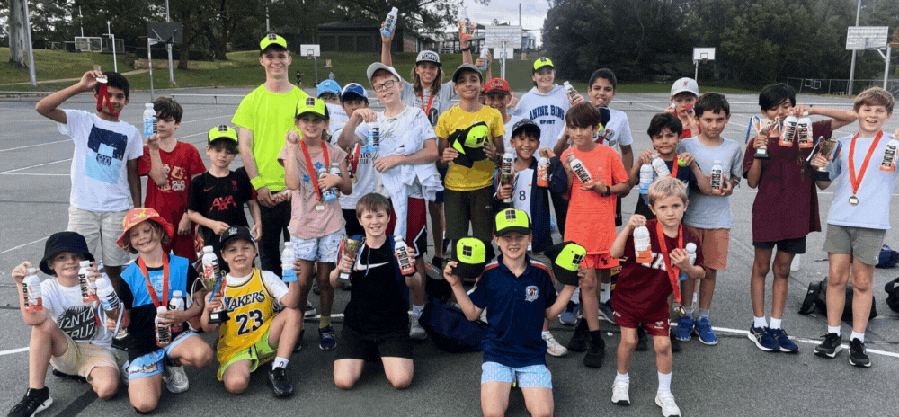 Kids having fun playing handball at a holiday camp program